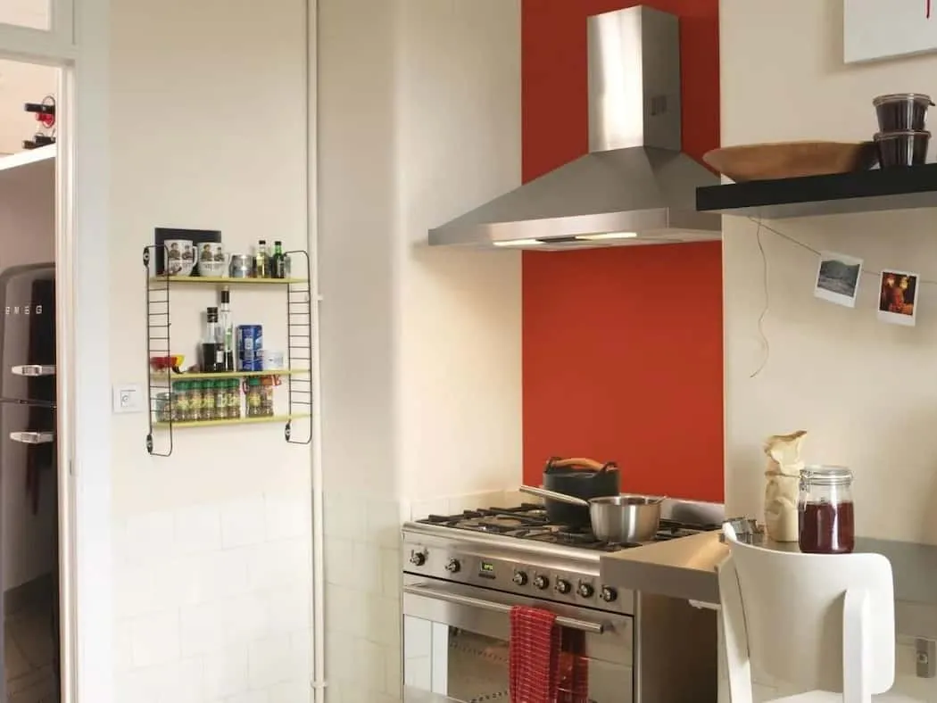 Kitchen with bold orange feature wall