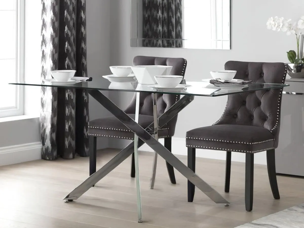 Glass dining table with chrome base
