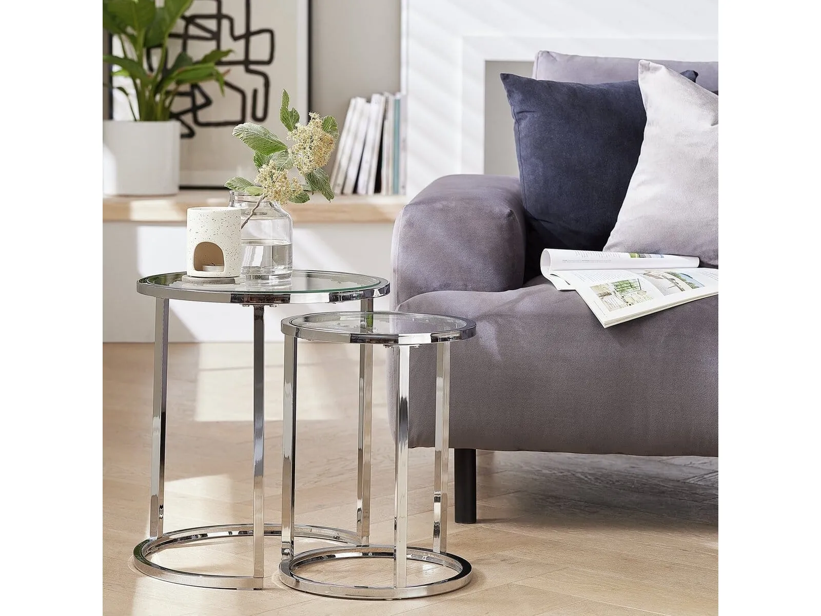 Pair of silver framed side tables with glass tops