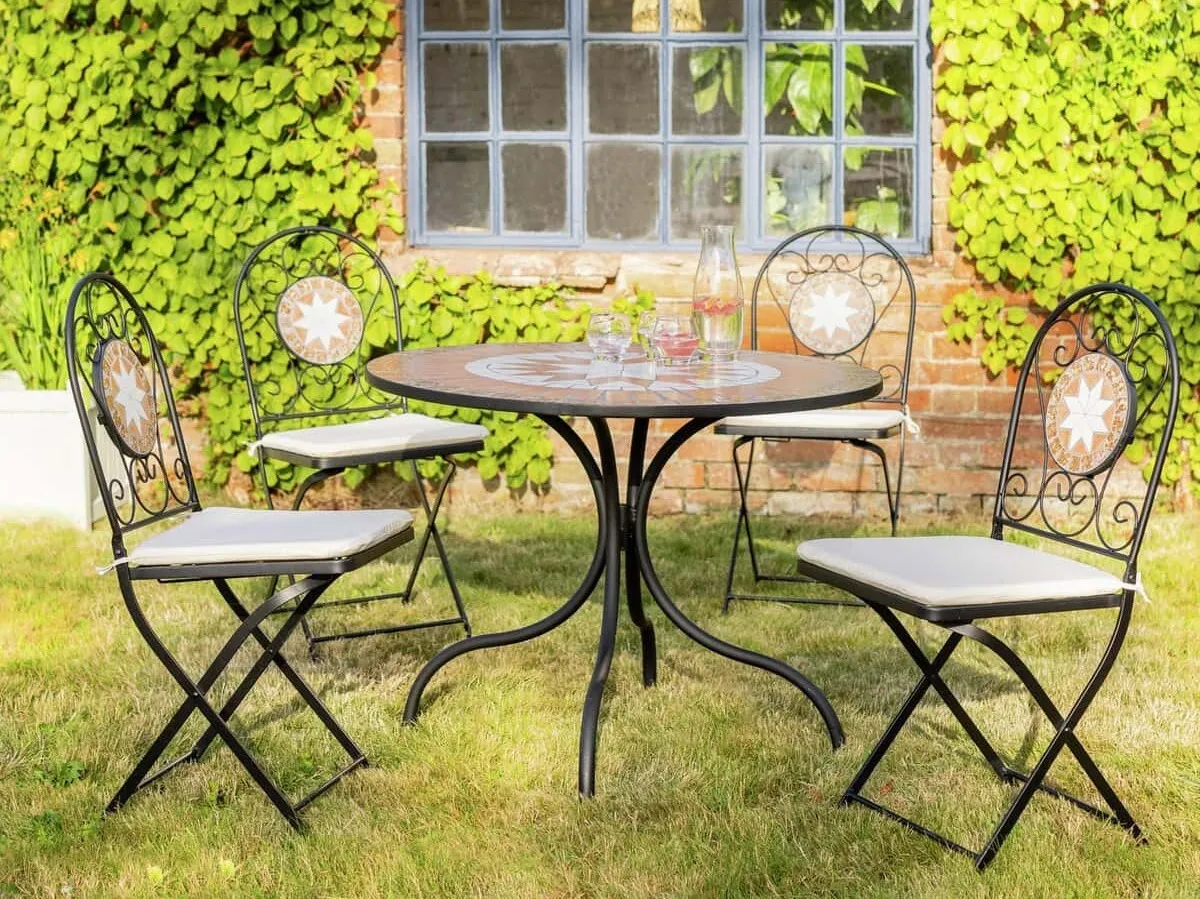 Round metal garden table and 4 matching chairs