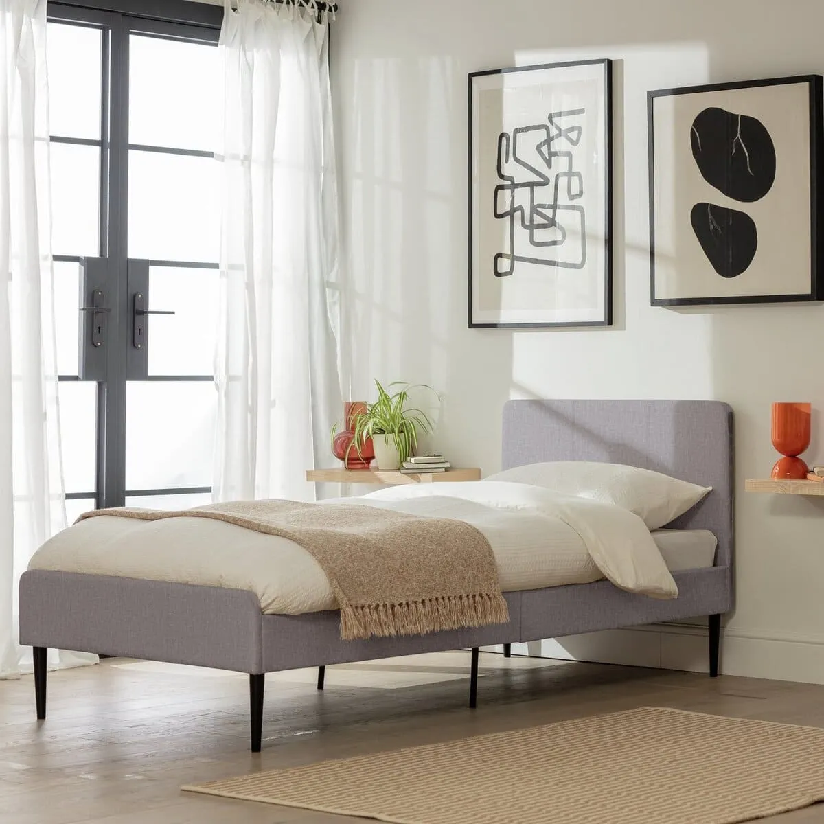 Grey fabric upholstered single bed