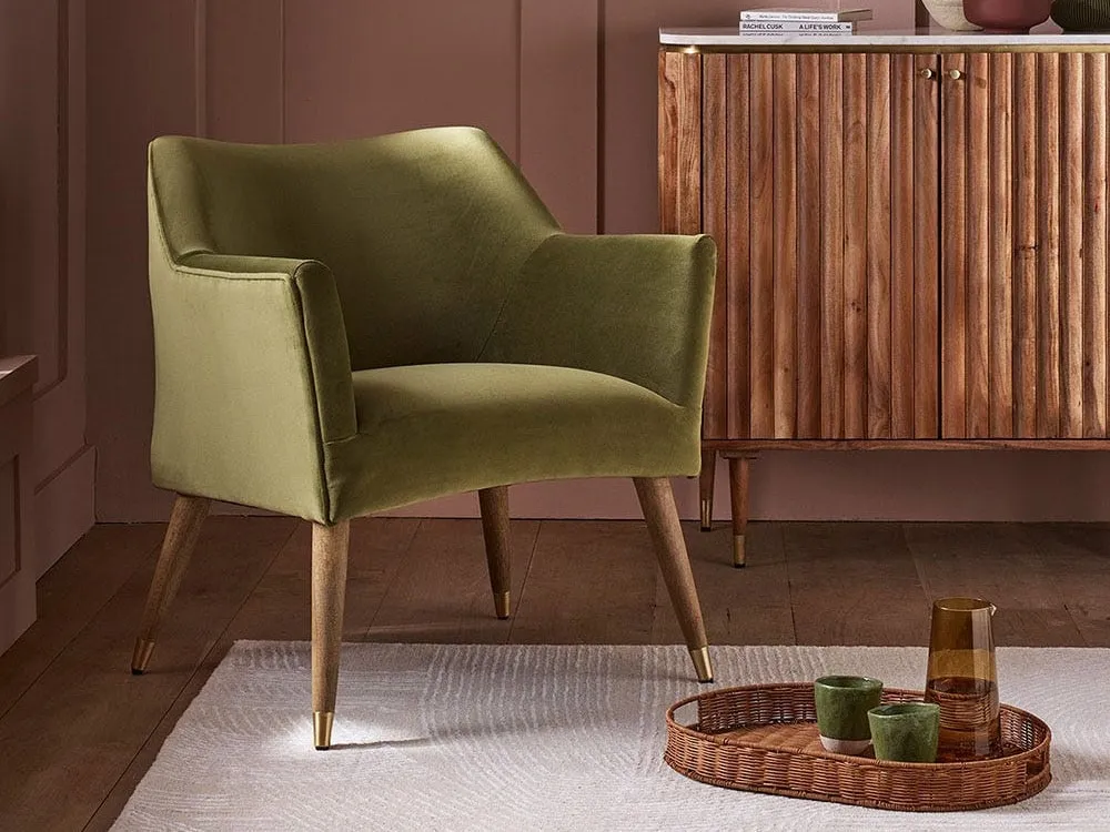 Green velvet upholstered armchair
