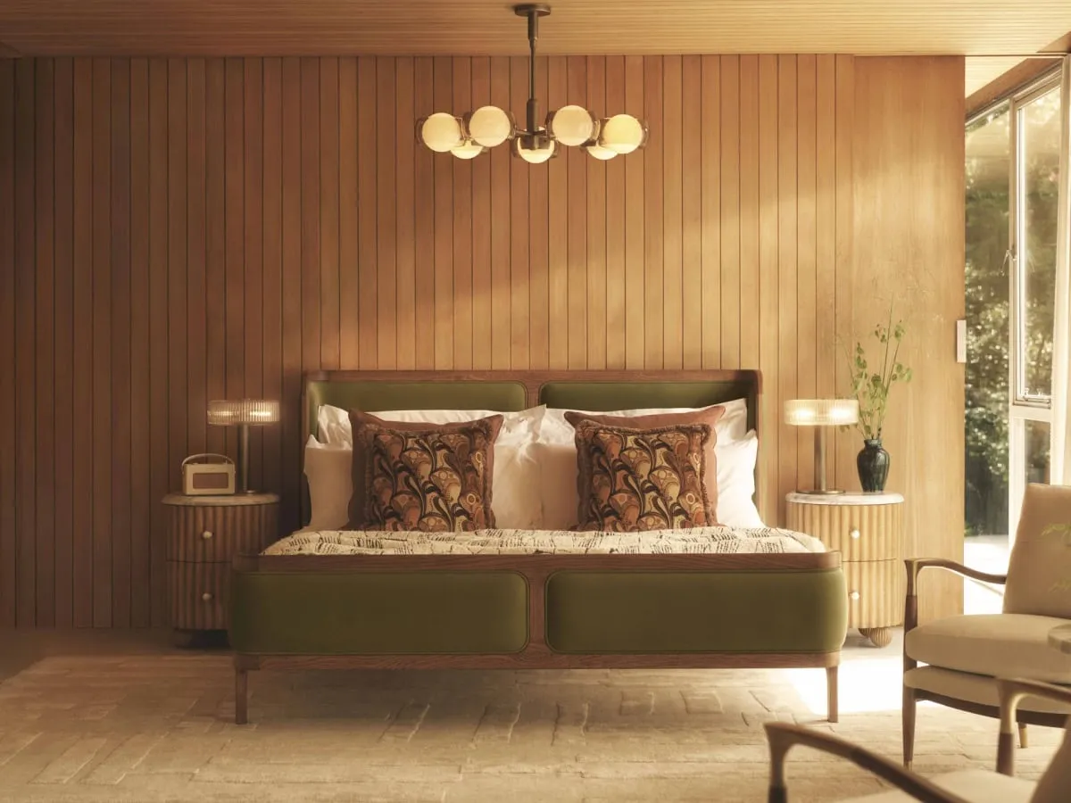 Dark oak bed frame with green velvet upholstered headboard