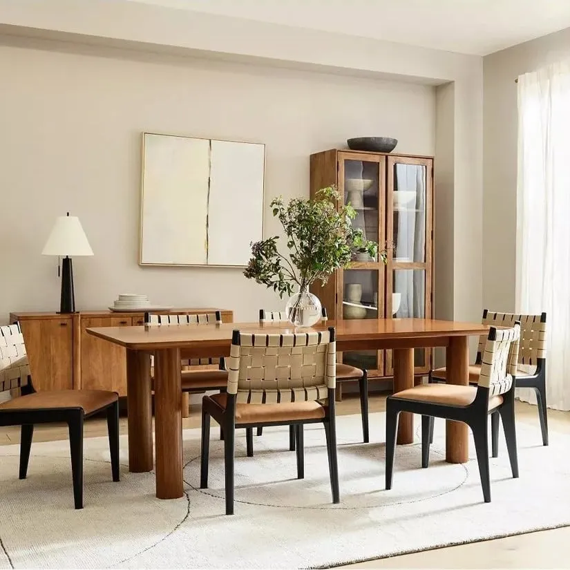 Walnut dining table with chunky round legs