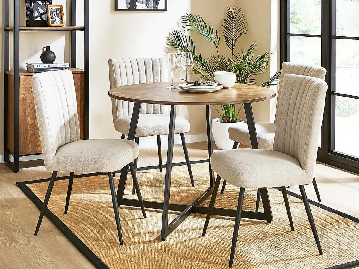 Round dining table with black legs and parquet-effect wooden top
