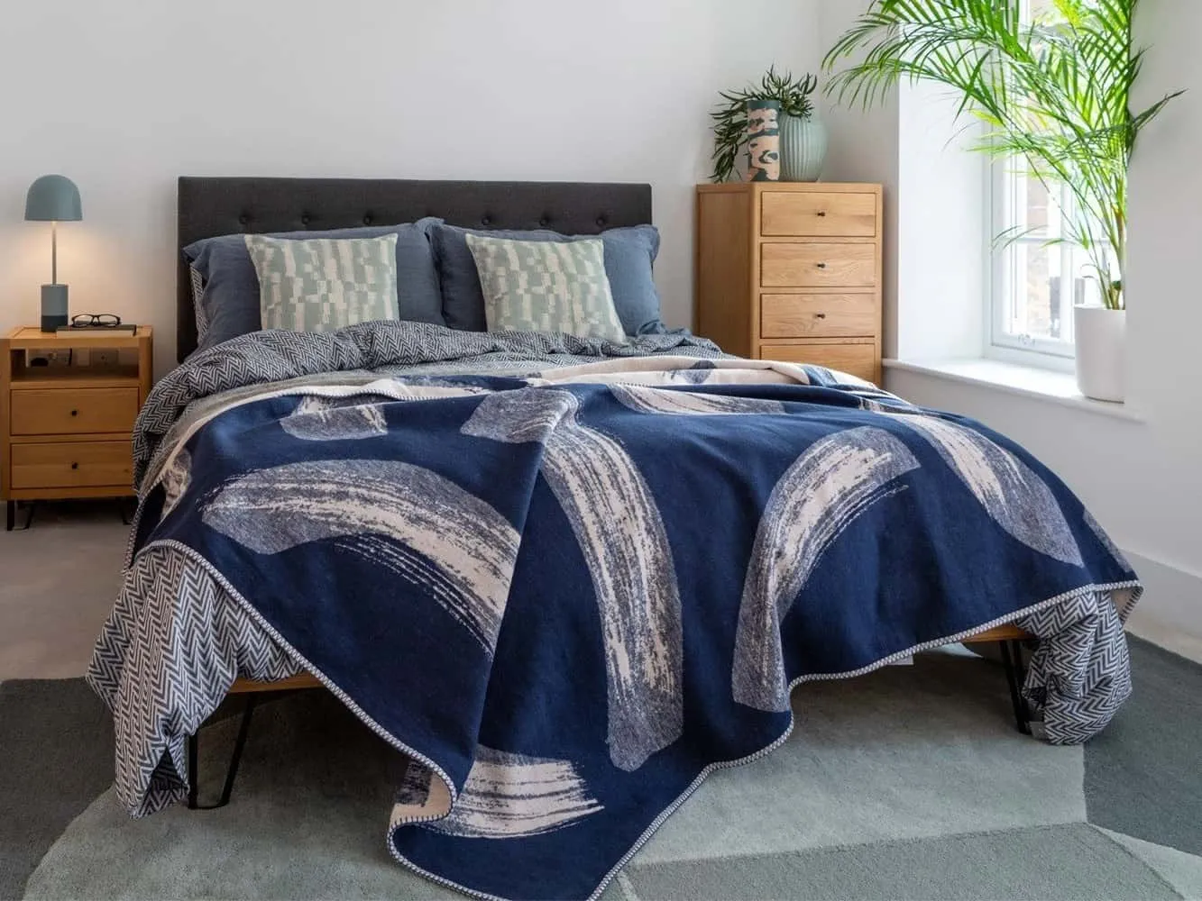 Oak bed with fabric upholstered headboard