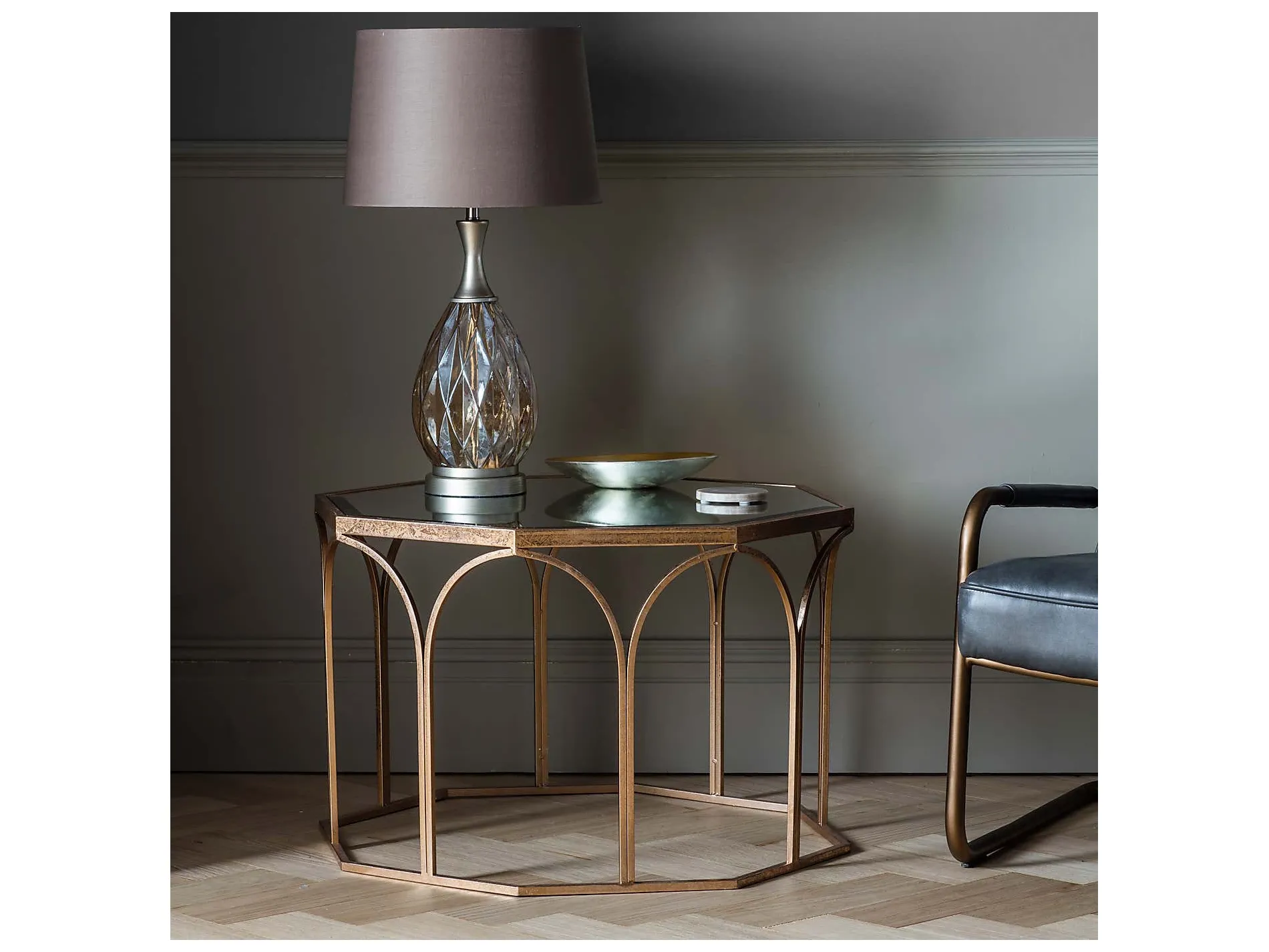 Gold octagonal coffee table with glass top