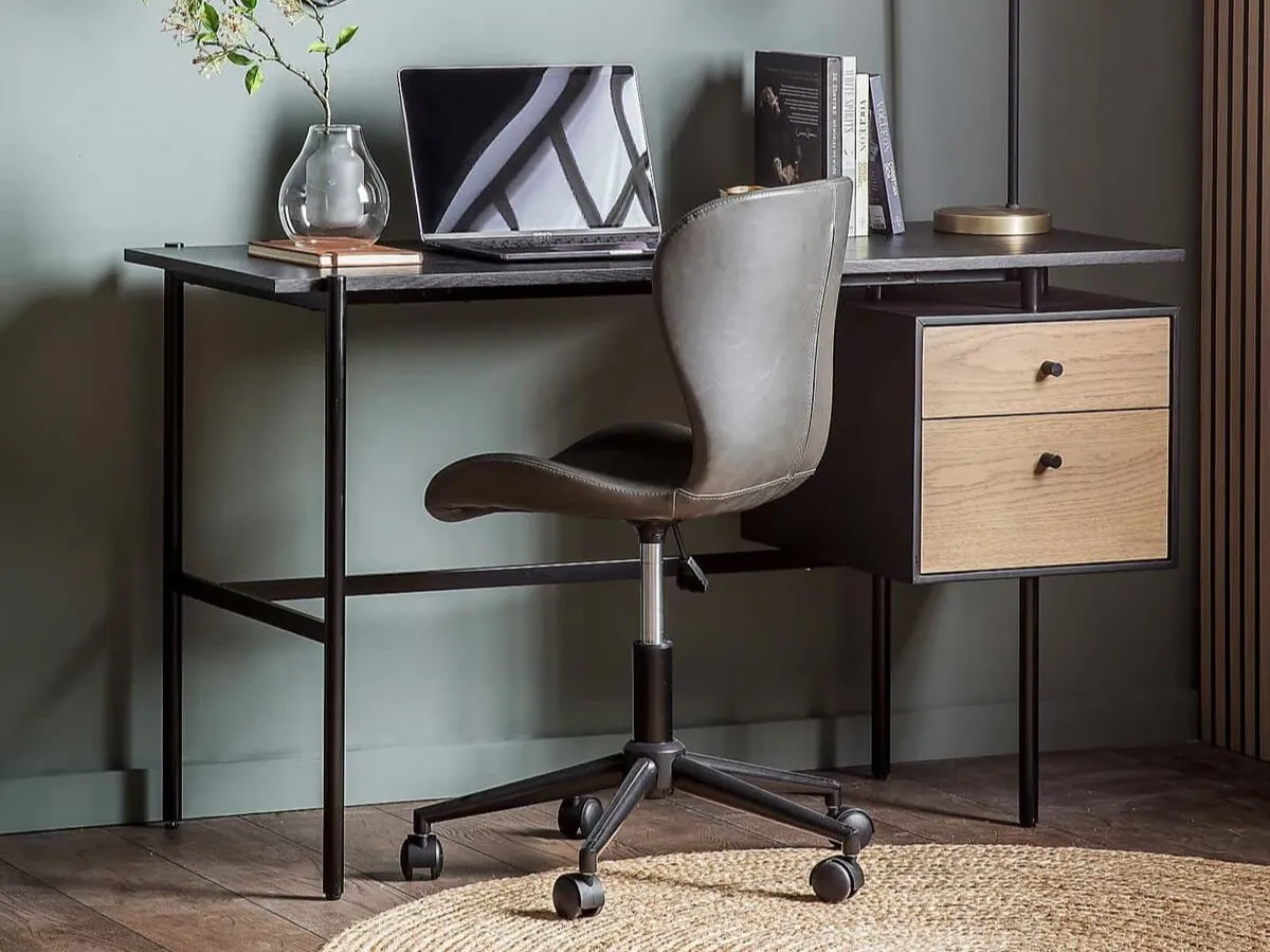 Black desk with tubular metal frame and a pair of suspended drawers with oak fronts