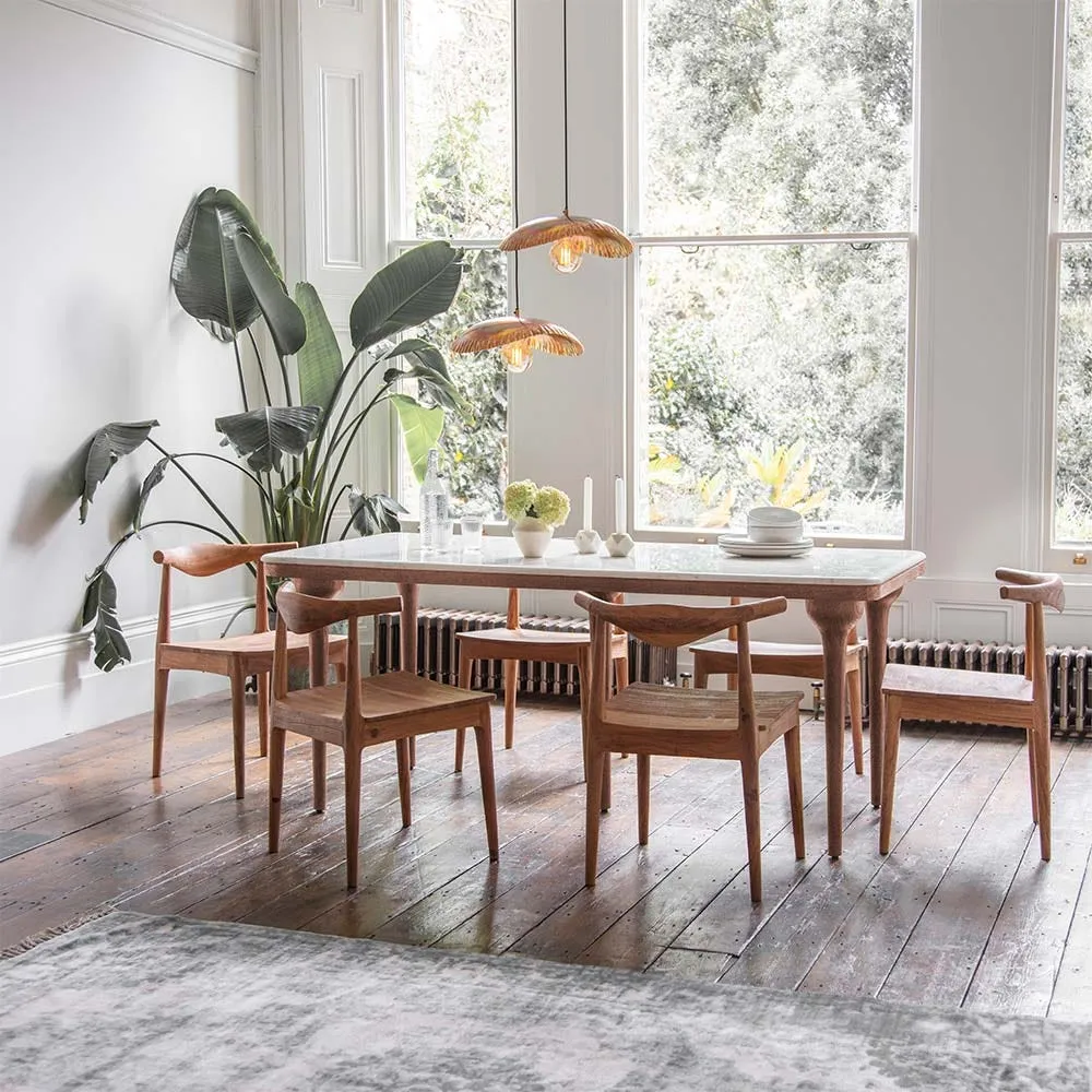 Rectangular dining table with marble top and distinctive turned wooden legs