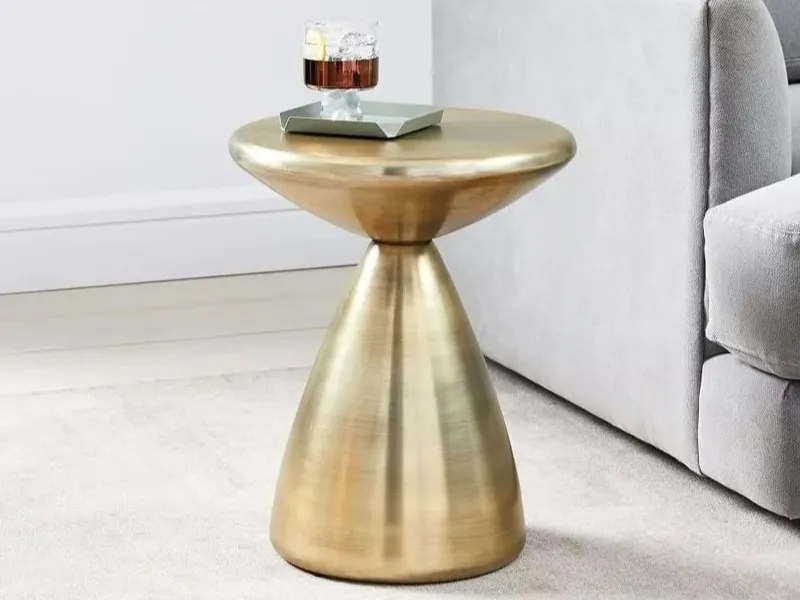 Round side table with conical base and antique brass finish