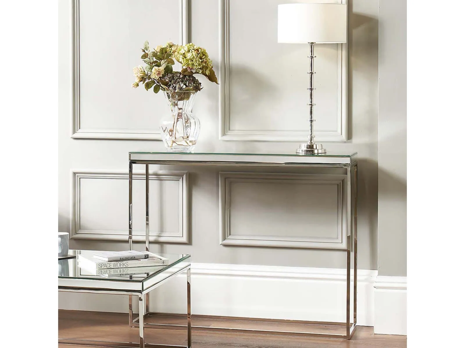 Polished metal frame console table with glass top