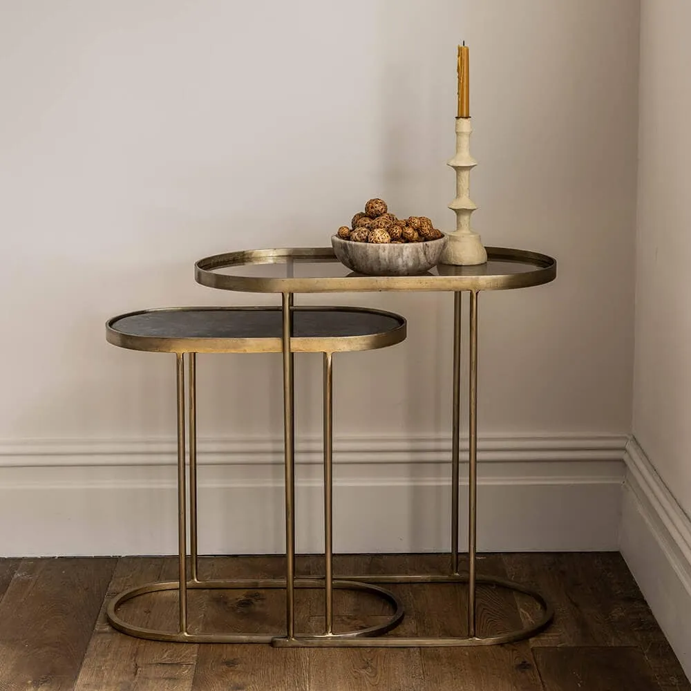 Pair of oval brass frame tables