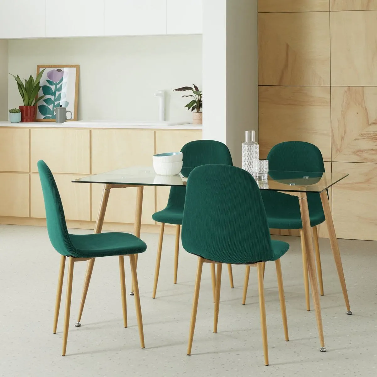Glass dining table on oak legs with 4 green dining chairs