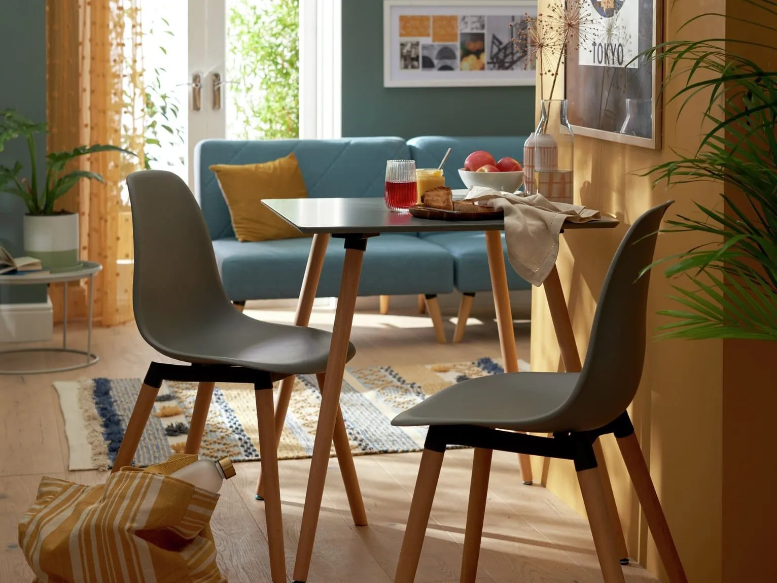 Retro inspired dining table with a grey top and natural splayed tapered legs