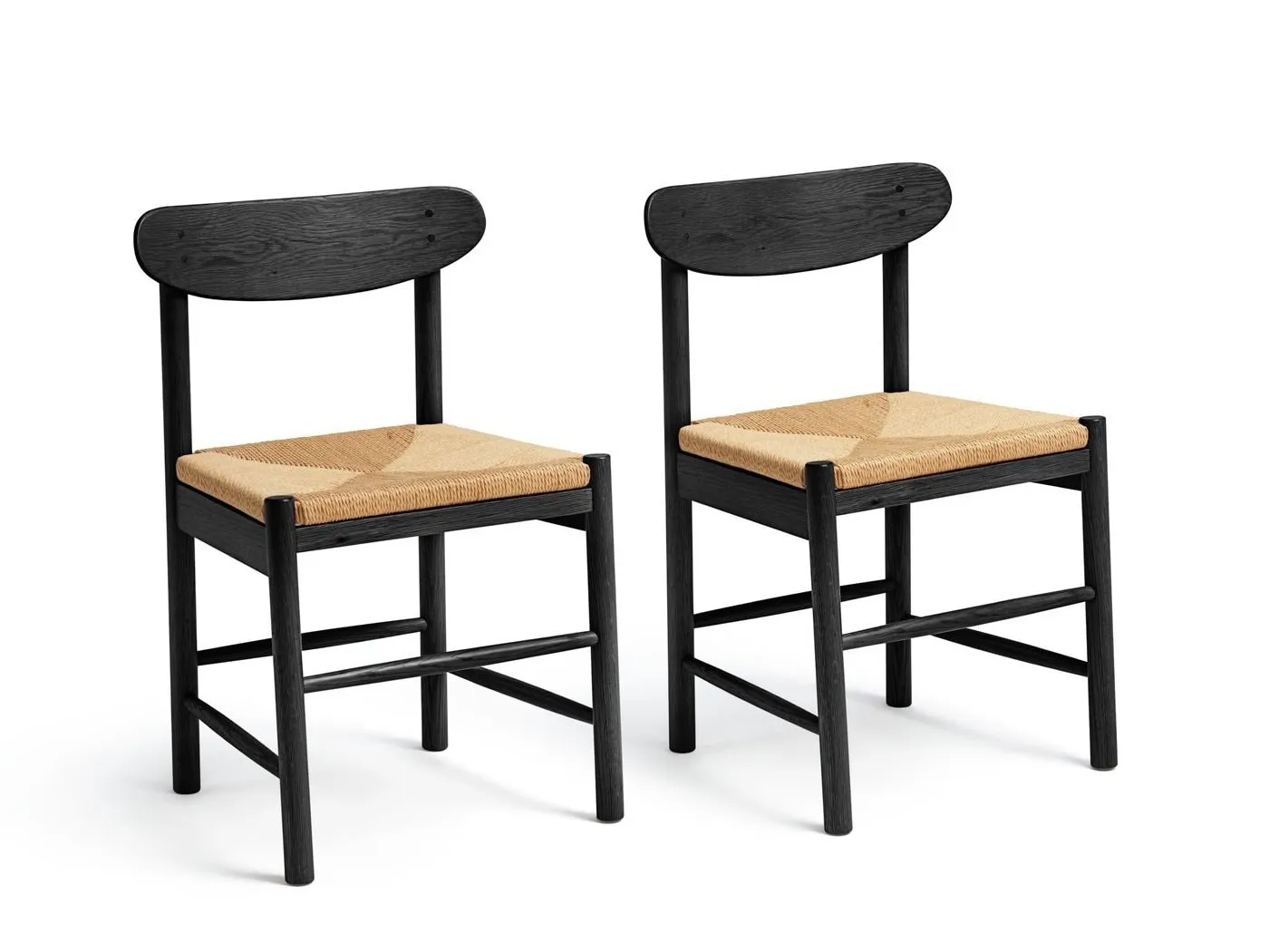 Black wooden dining chairs with woven seat pads