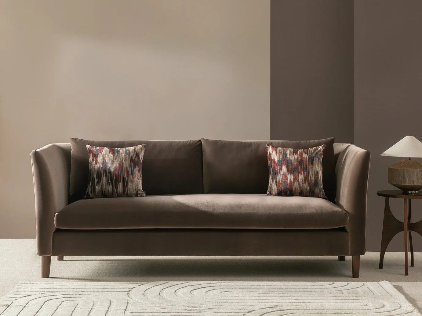 Brown velvet upholstered sofa