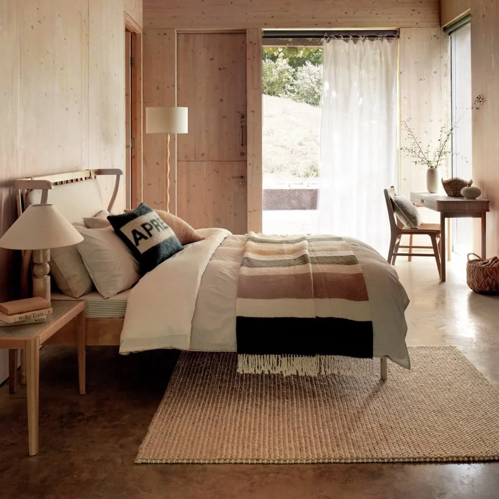 Spindle bed with upholstered headboard