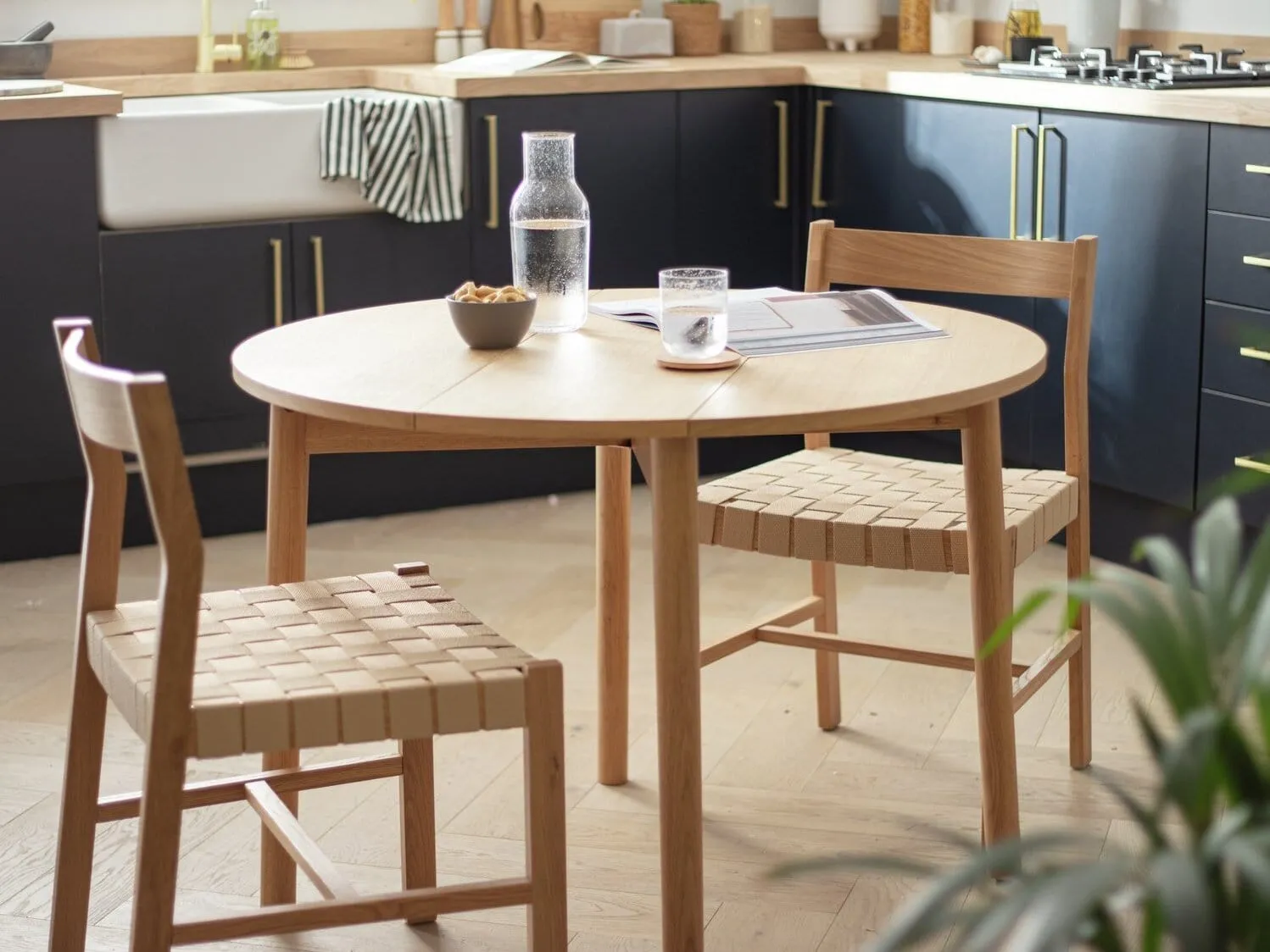 Round oak extending dining table