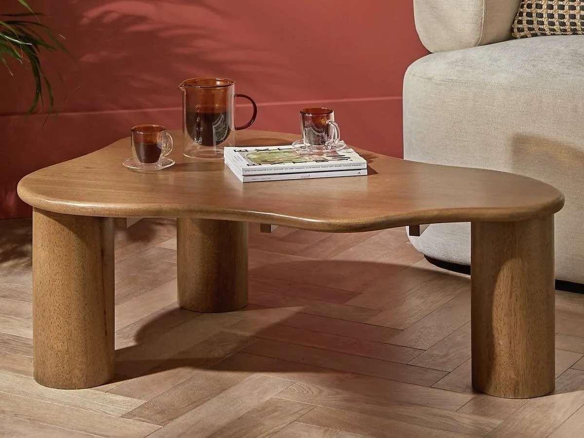 Wavy walnut coffee table with stout round legs