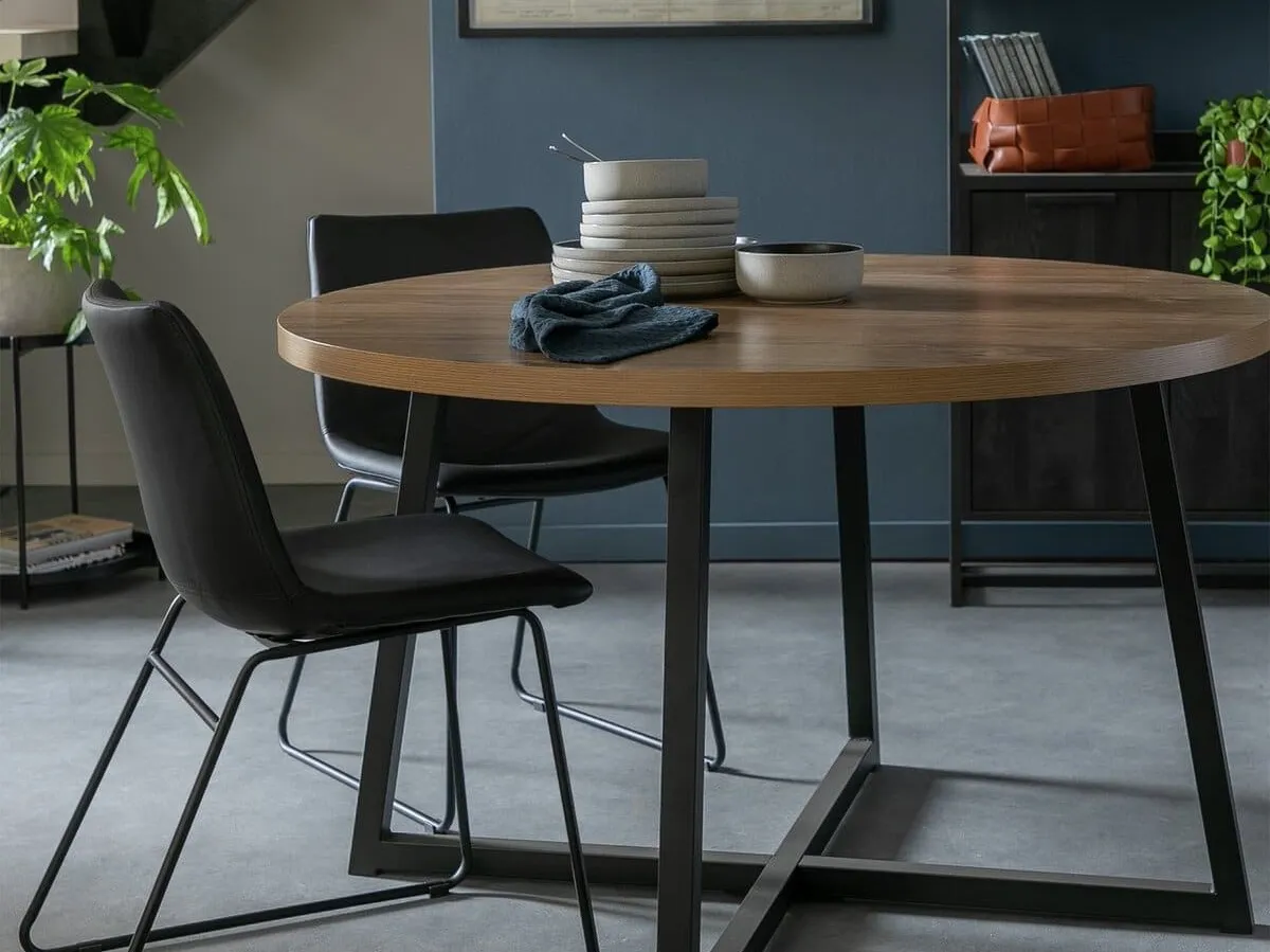 Round oak effect dining table with black painted legs