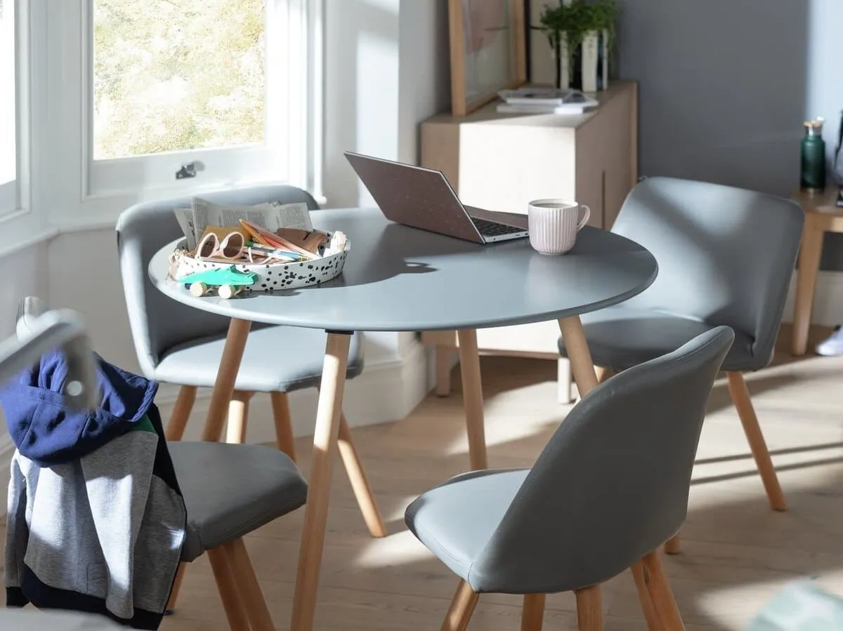 Round grey dining table and 4 grey chairs