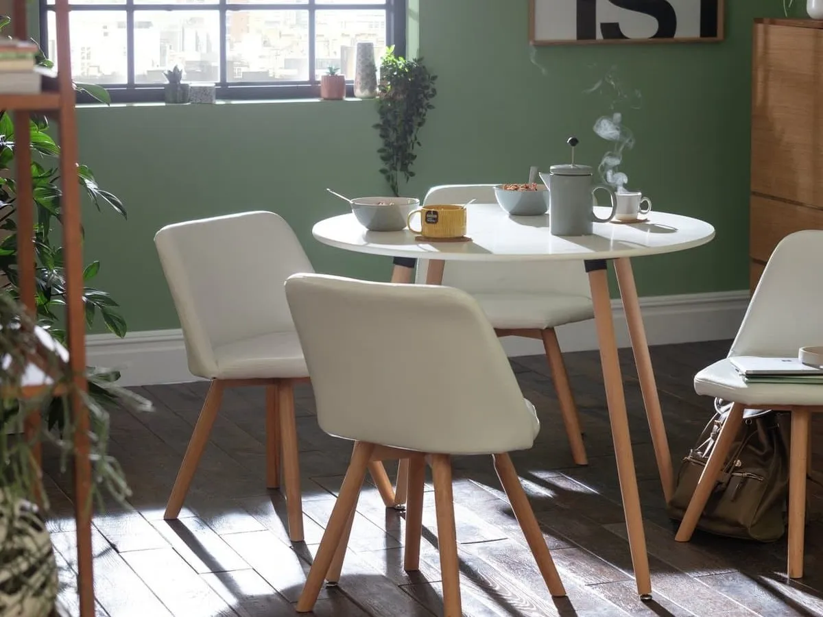 Round white dining table and 4 white dining chairs