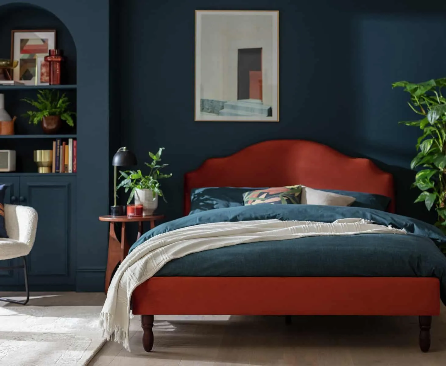 Deep red velvet upholstered bed