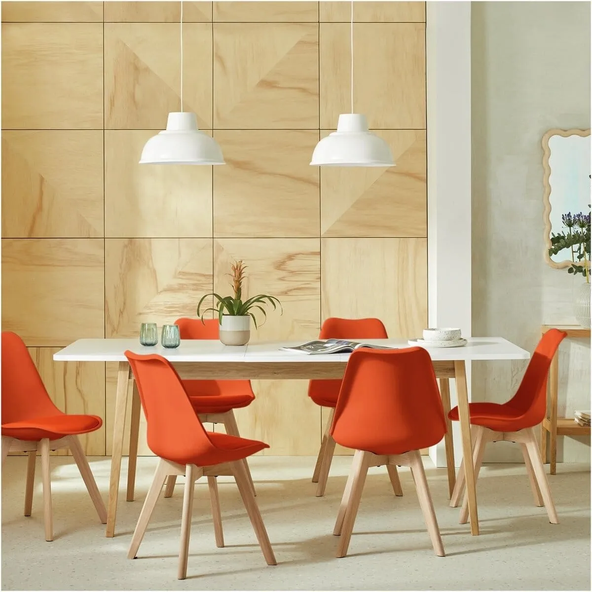 White dining table and 6 orange chairs