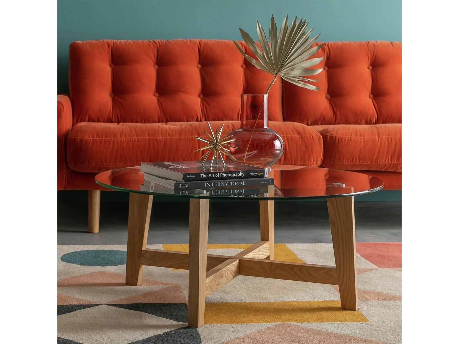 Round wooden frame coffee table with glass top