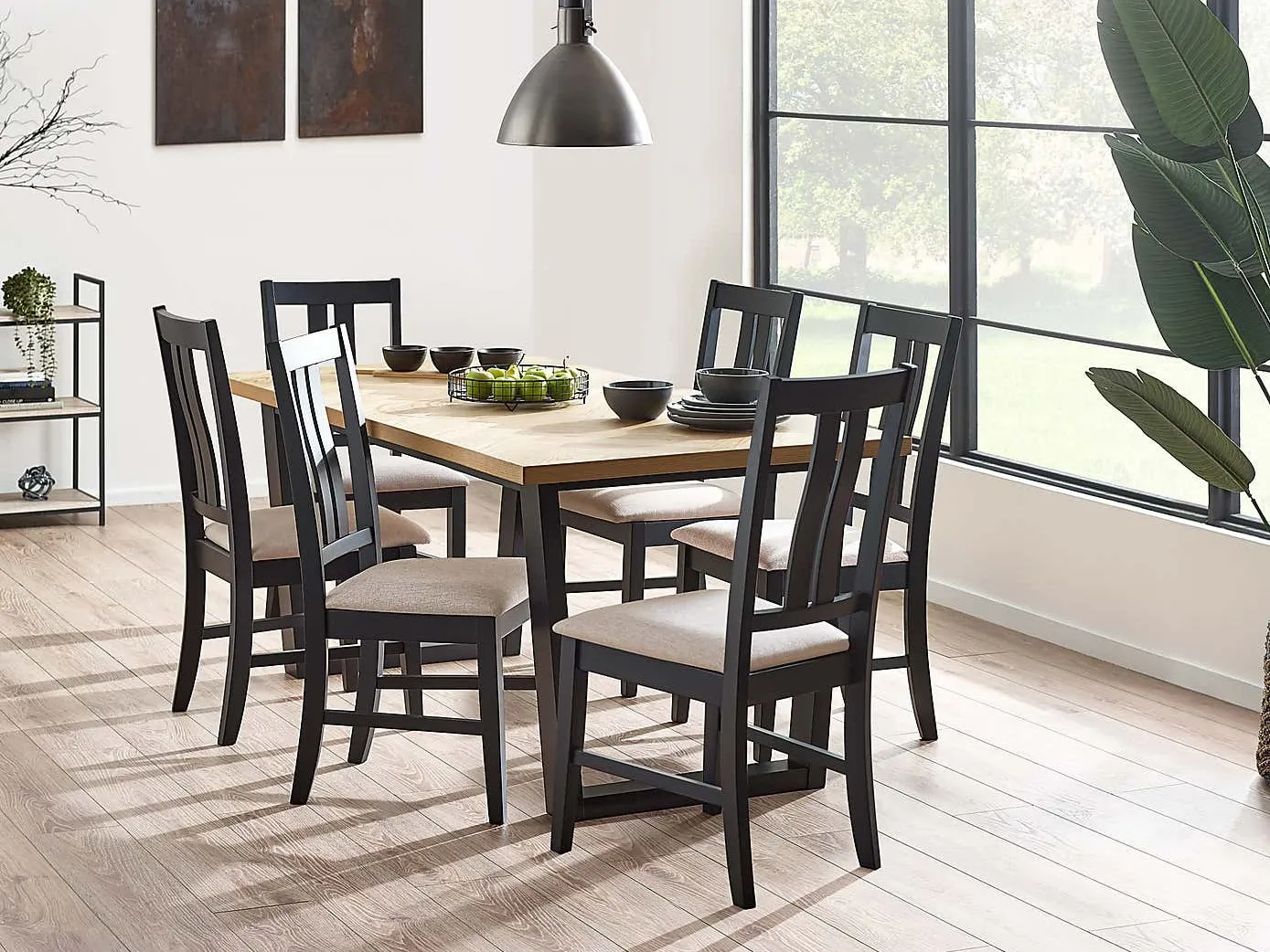 Dining table with an oak veneer top and black-painted legs