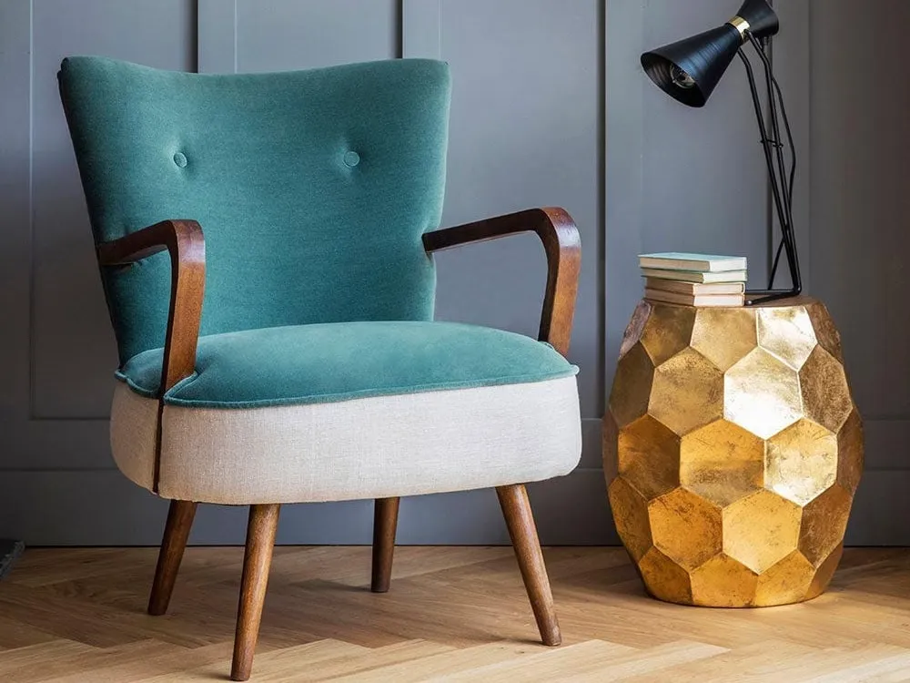 Gold coloured side table with geometric pattern sides