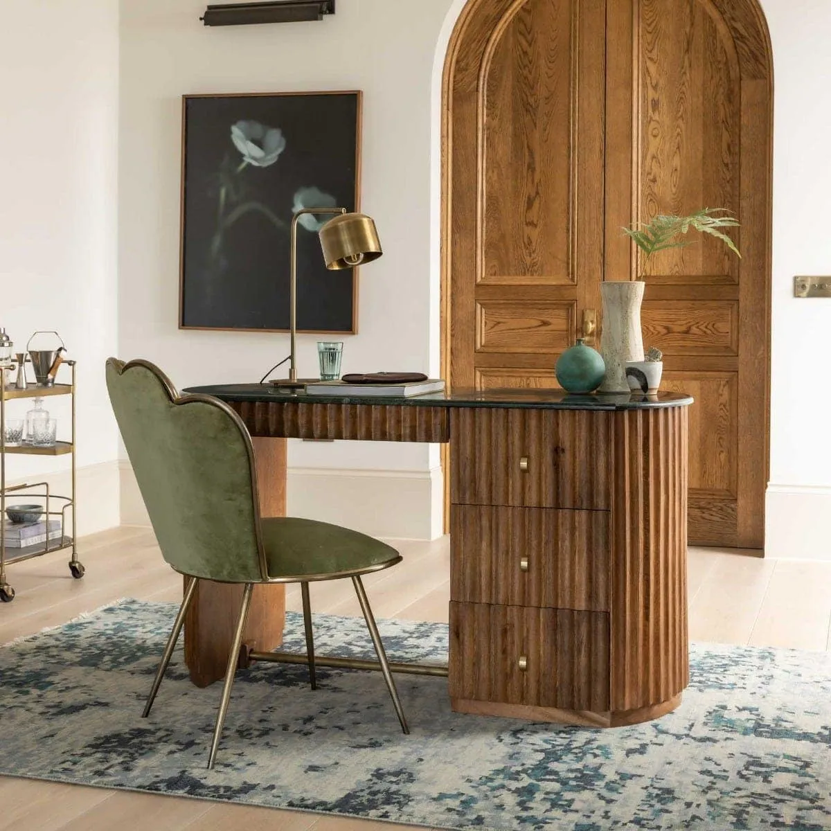 Single pedestal mango desk with fluted finish and forest green marble top