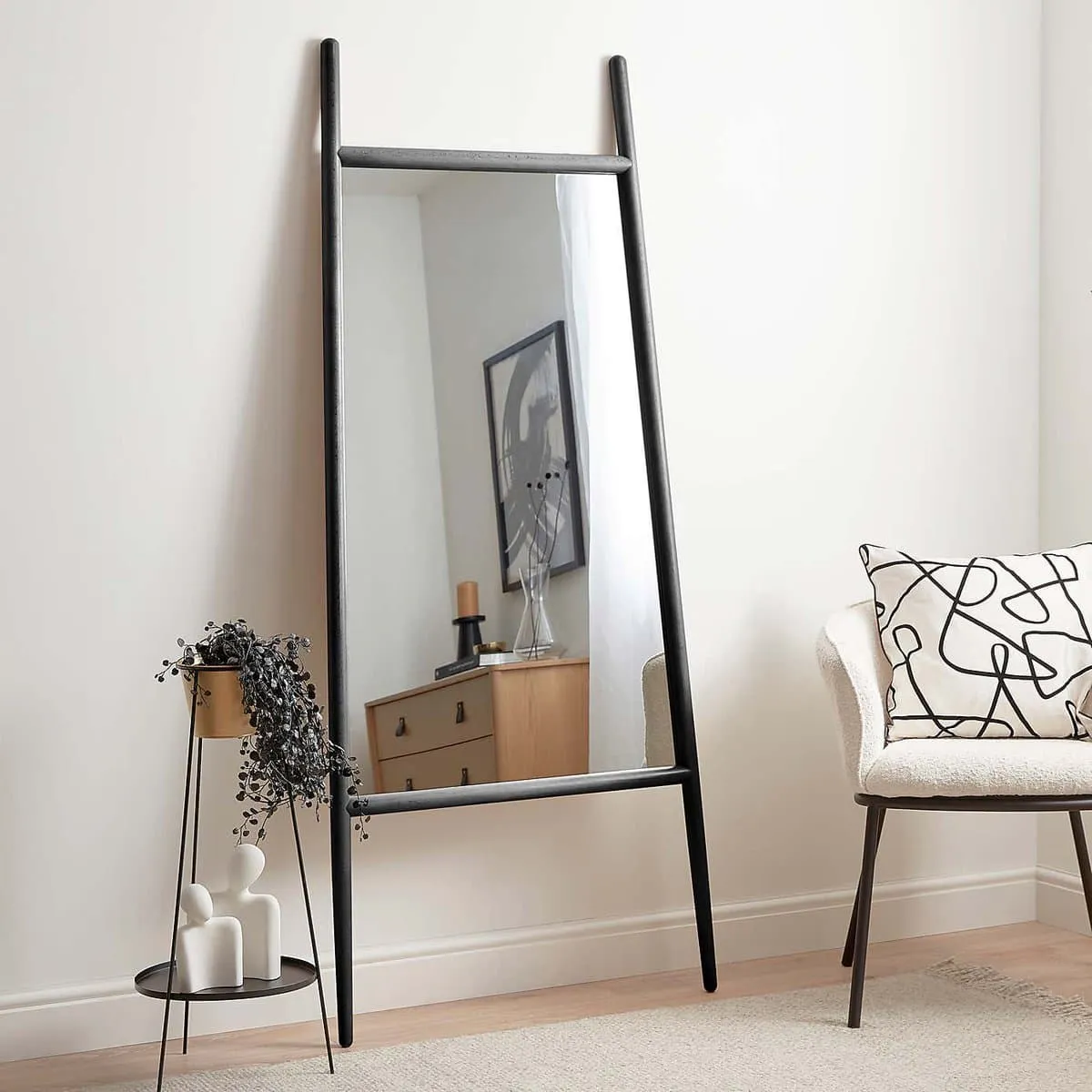 Black frame leaning wall mirror