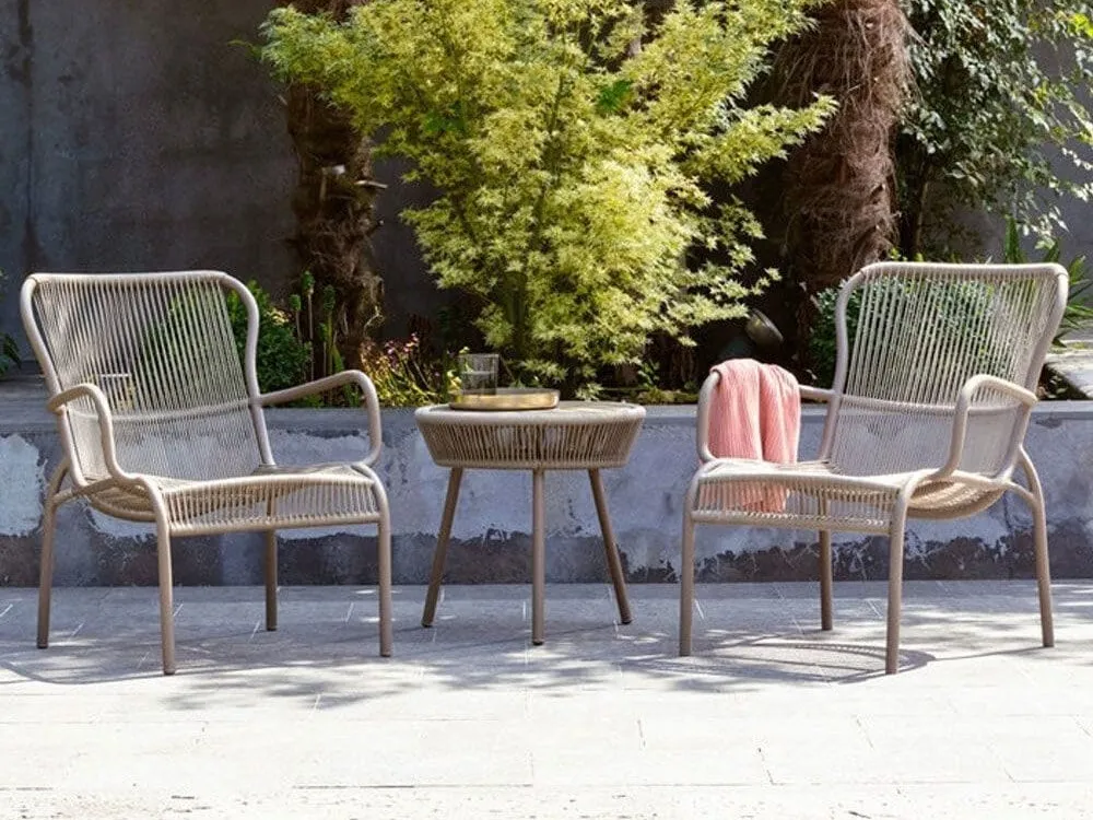 Outdoor lounging chairs and a matching bistro table