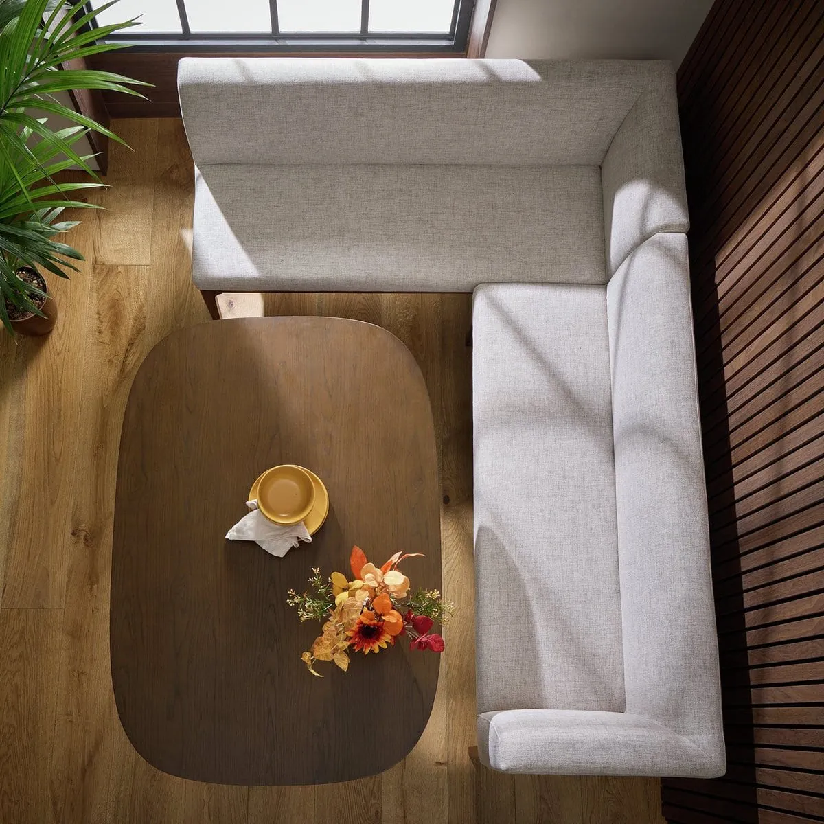 Walnut dining  table and grey fabric corner bench