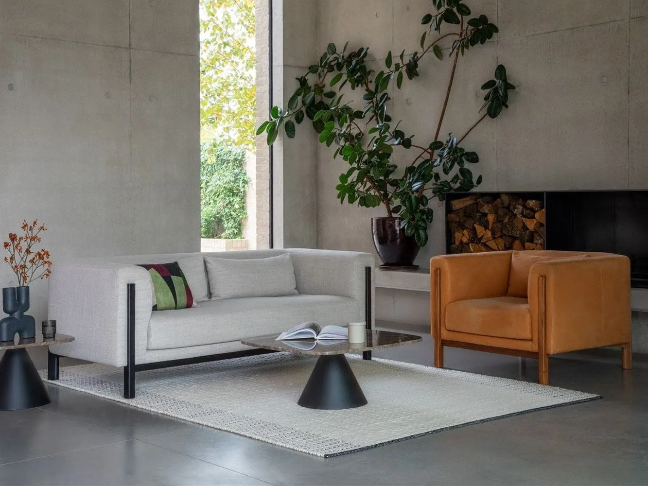 Grey fabric sofa with black trim