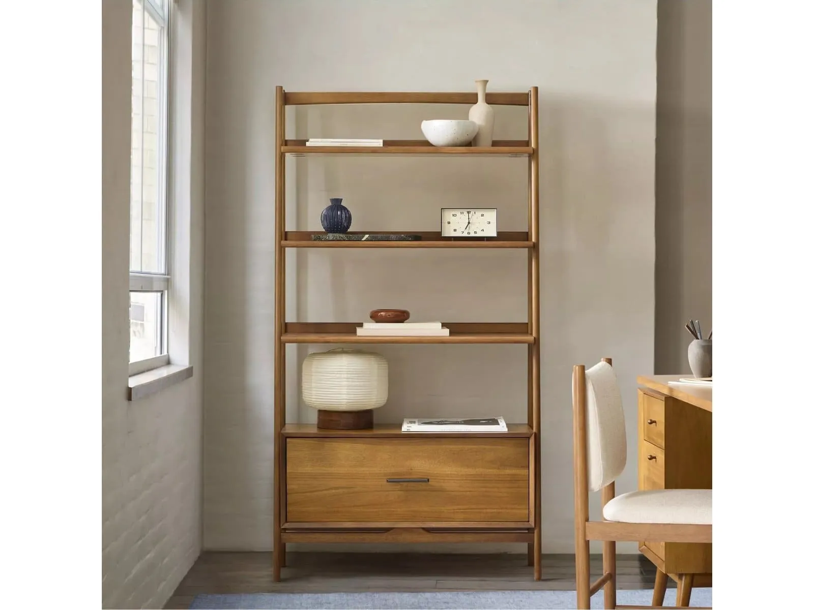 Mid-century-style bookcase with drawer in base