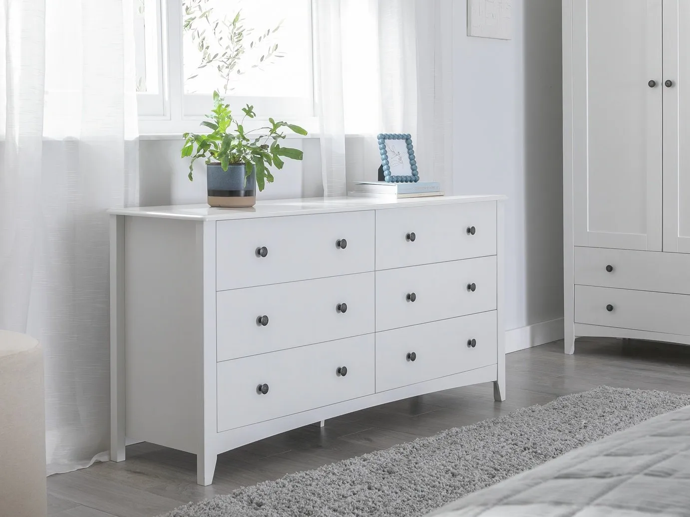 White-painted bedroom furniture