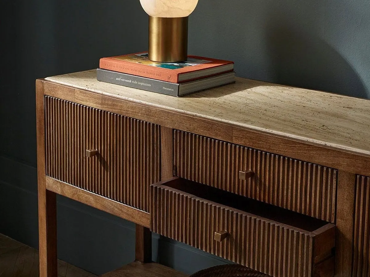 Mango wood sideboard with grooved pattern drawers and travertine top