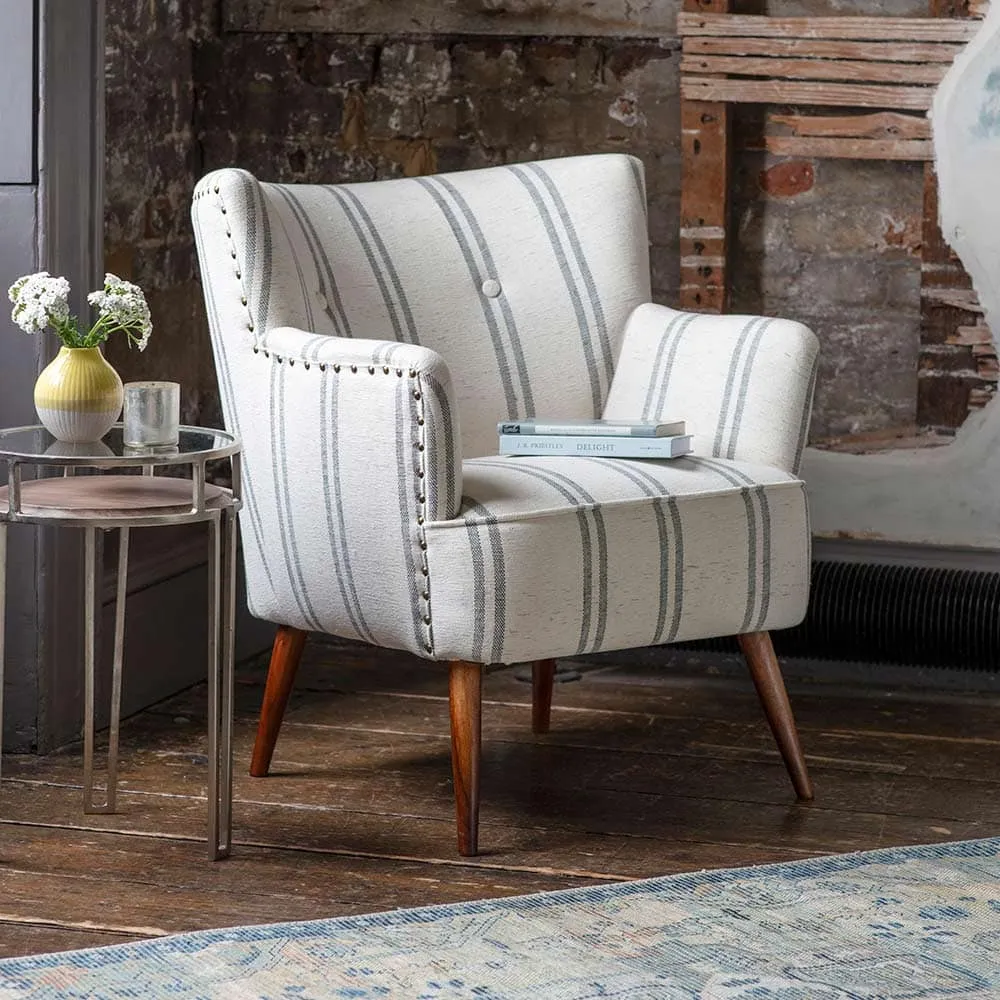 White/grey striped cotton fabric upholstered armchair with wooden legs