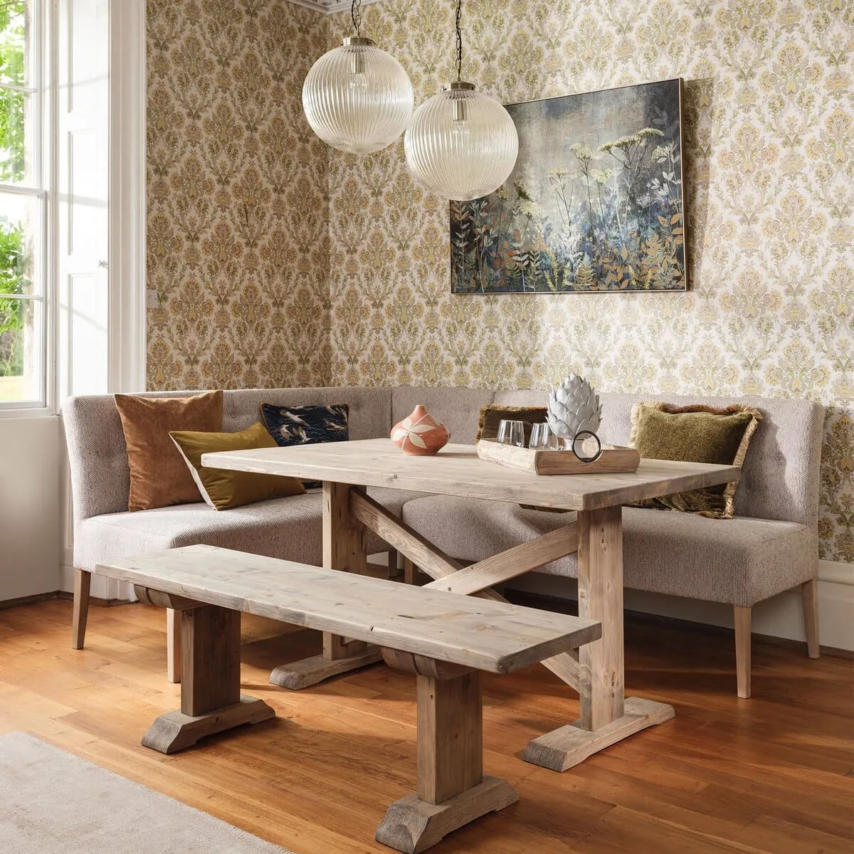 Reclaimed wood dining table and bench with an upholstered corner dining bench