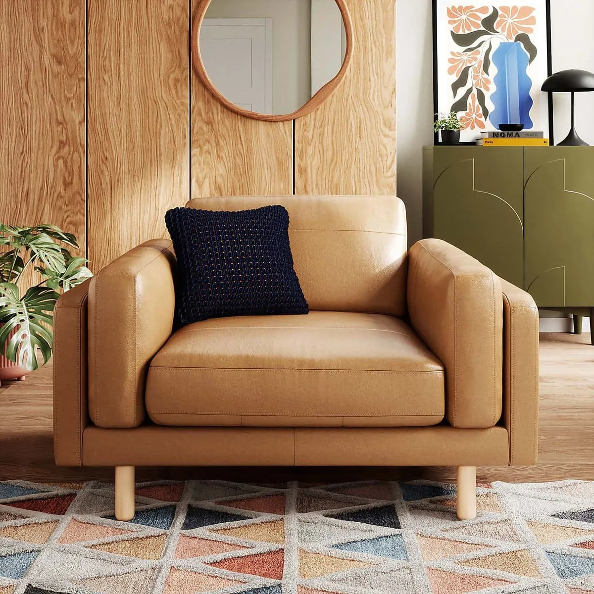 Tan leather snuggler armchair