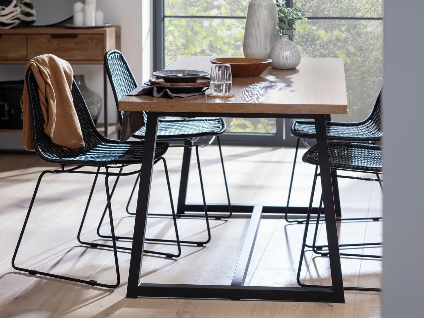 Oak dining table with black metal frame
