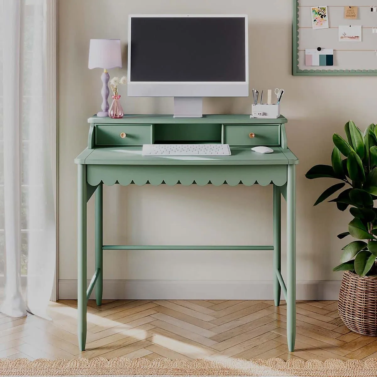 Green-painted secretary desk with scalloped edge detail