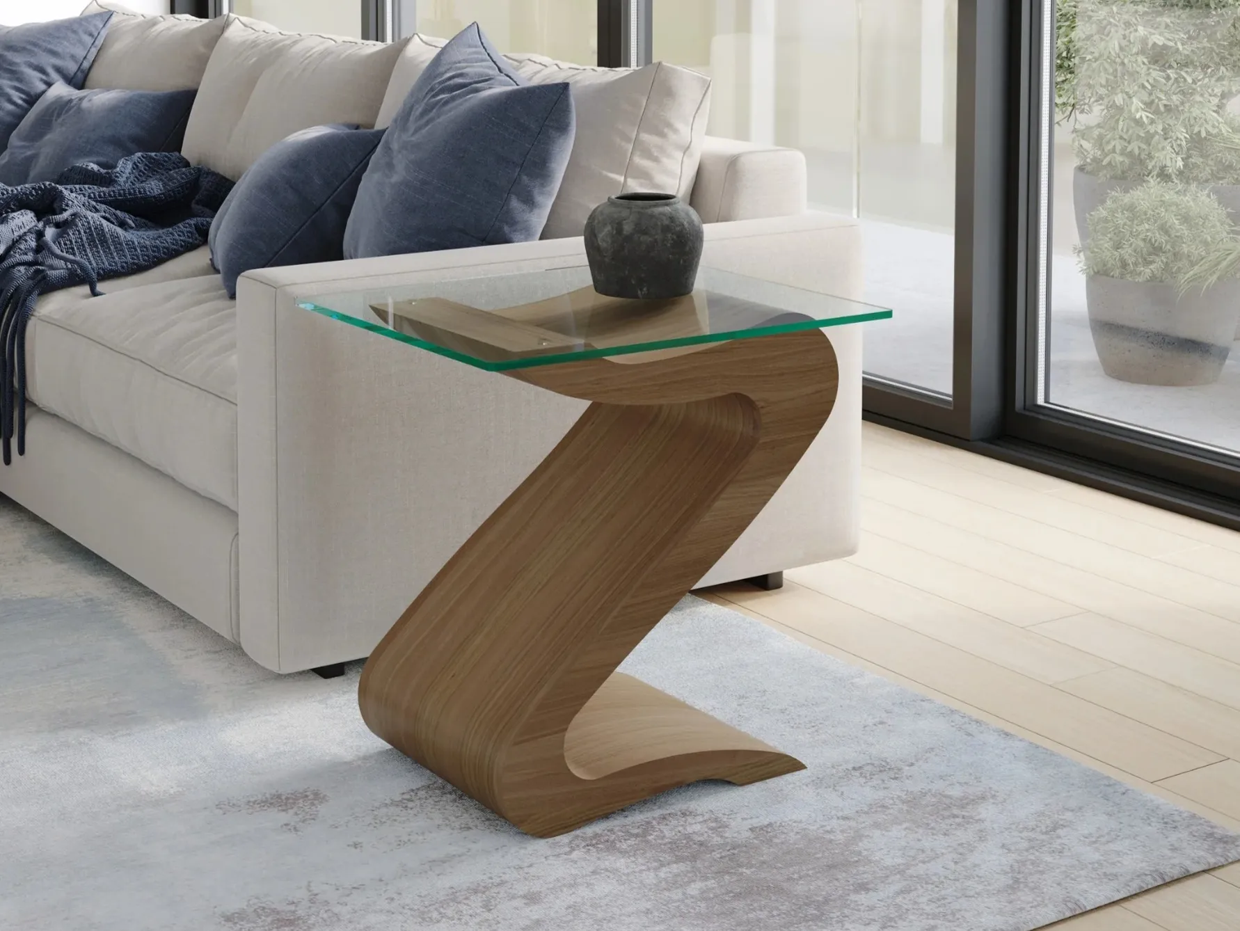 Glass top side table with curved walnut base