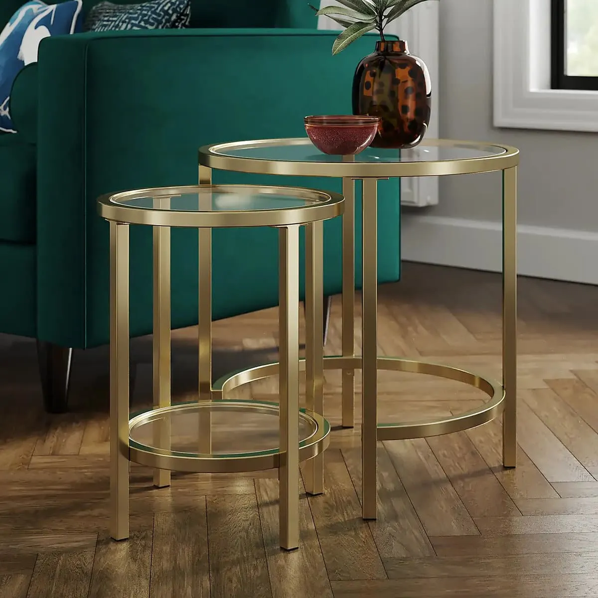 Round glass side tables with gold coloured frames