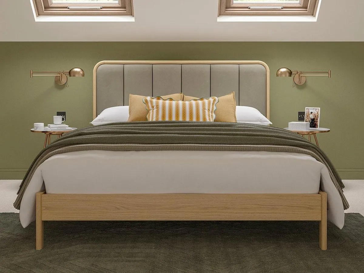 Oak bed with taupe upholstered headboard