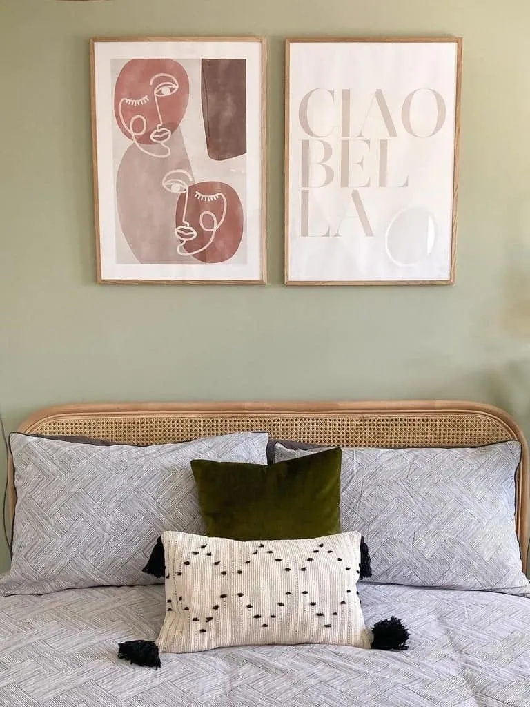 Pale green painted bedroom wall