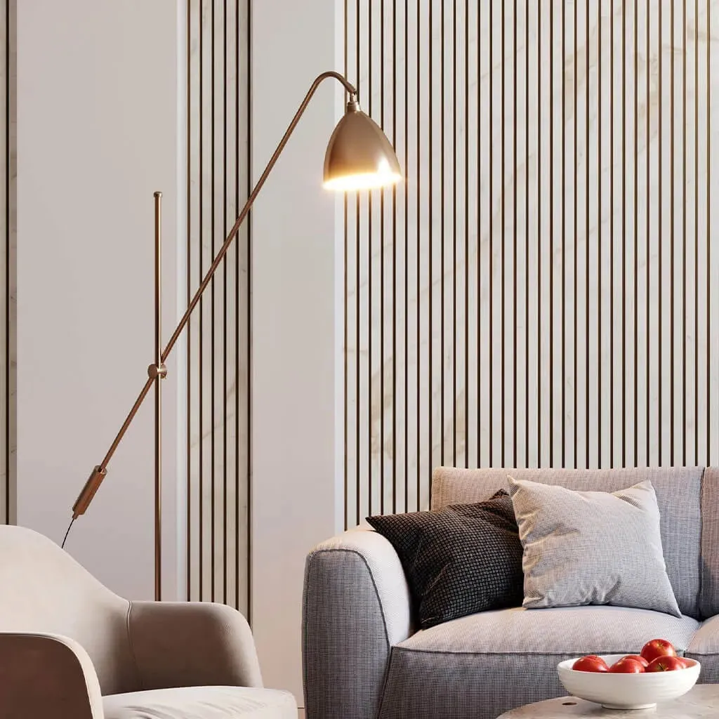 White marble slatted wall panels as a backdrop to a statement sofa