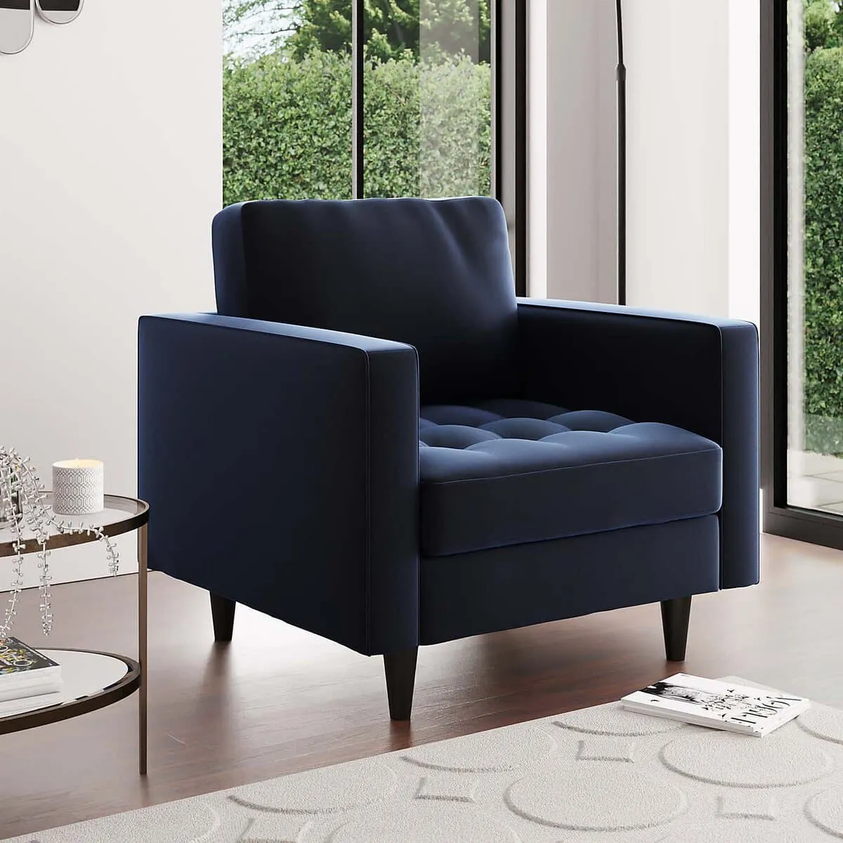 Navy velvet upholstered armchair with tapered wooden legs